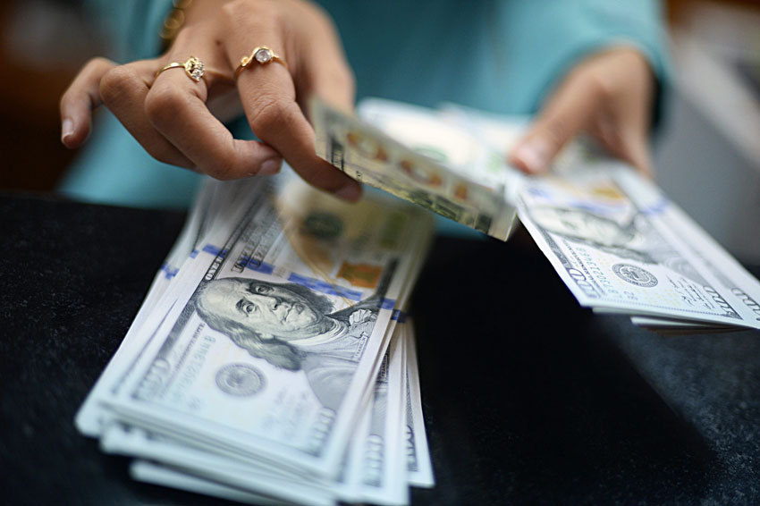 דולרים, צ'יינג' (צילום אילוסטרציה: Bloomberg)